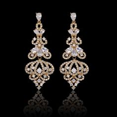 Our Lush Chandelier Earrings are a gorgeous accessory. They're long, detailed with crystal dangles to resemble the ornate finial of a chandelier. Pair these striking earrings with a date night dress and watch heads turn as you walk into the room. Premium Materials - Made from authentic gemstones & nickel-free metal Jewellery Sketch, Antique Luxury, Chandelier Earring, Diamond Chandelier Earrings, Diamond Chandelier, Bridal Earrings Chandelier, Gold Chandelier Earrings, Diamond Shape Earrings, Date Night Dress