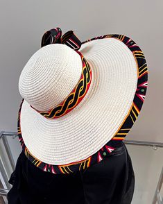 ombines timeless elegance with vibrant cultural flair. Handcrafted with care, this hat features a beautifully woven straw base adorned with bold African print fabric, offering both style and sun protection. Perfect for church services, outdoor events, or simply adding a touch of sophistication to your outfit, this hat blends tradition with modern design. Lightweight and breathable, it's as comfortable as it is striking. Elevate your look with a hat that celebrates heritage and craftsmanship. One size: should fit all. Ankara Sun Hat, Summer Straw Hat With Uv Protection, One Size, Ankara Bags, Juju Hat, Spice Gift, Mask Painting, African Print Fabric, Long Sleeves Jacket, African Fabric