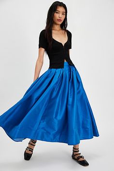 A true party staple, this special stunning skirt will turn heads with every wear. **Fit:** High-rise, full A-line silhouette **Features:** Sheen finish, pleating at top, finished hem, invisible zip closure, poplin fabrication **Why We ❤ It:** An essential piece to dress up or down, pair this with a silky cami or chunky sweater for endless ways to wear. | Emilia Full Skirt by Free People in Blue, Size: M A-line Pleated Maxi Skirt For Party, Evening A-line Skirt With Pleated Waist, Evening A-line Pleated Skirt With Lining, Evening A-line Dress With Relaxed Skirt, Fitted A-line Maxi Skirt For Evening, Voluminous A-line Skirt For Evening, Fitted A-line Maxi Skirt With Gathered Detail, Fitted Skirt For Summer Prom, Flowy A-line Pleated Skirt For Party