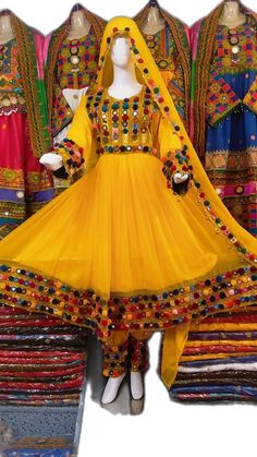 Bohemian Dresses With Multicolor Embroidery For Navratri, Bohemian Embroidered Dress With Mirror Work For Ceremonies, Bohemian Embroidered Dress With Mirror Work For Navratri, Yellow Long Sleeve Dress With Mirror Work, Folk Style Multicolor Dress For Navratri, Traditional Multicolor Embroidered Long Sleeve Dress, Folk Style Multicolor Navratri Dress, Traditional Multicolor Dresses For Eid, Bohemian Dresses With Mirror Work For Traditional Ceremonies