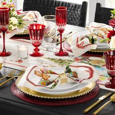 the table is set with red and white dishes