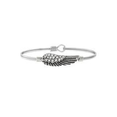 Luca + Danni's iconic, stacking bracelets are shaped to sit top of wrist so you can express the things that matter most to you. Celebrate your faith with this crystal angel wing bangle from Luca + Danni, featuring an oval design for a more comfortable fit. Luca + Danni's iconic, stacking bracelets are shaped to sit top of wrist so you can express the things that matter most to you. Celebrate your faith with this crystal angel wing bangle from Luca + Danni, featuring an oval design for a more com Casual Silver Bangle Cuff Bracelet, Silver Stackable Jewelry For Friendship, Casual Stackable Bangle Jewelry, Silver Casual Wrap Bracelet As Gift, Casual Silver Stackable Jewelry, Casual Silver Stackable Bracelets, Silver Casual Wrap Bracelet For Gift, Casual Stackable Bangle Bracelets, Casual Stackable Bracelet Jewelry