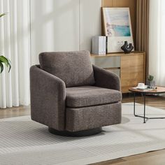 a living room with a chair and rug