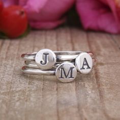 "Mix and match! Stack and spell! Say whatever you want with these stacking initial rings. Spell a child's name, stack your initials, or get one initial for each grandchild. **The price listed is for one sterling silver stacking ring but if you want more, you can change the quantity** These rings also look great stacked with our birthstone rings, find them at this listing: https://www.etsy.com/listing/192036913 ♥♥ HOW TO ORDER ♥♥ 1. FROM THE DROP DOWN BOX SELECT THE SIZE AND QUANTITY OF RINGS 2. Rings With Initials, Personalized Initial Ring, Silver Initial Ring, Initial Rings, Birthstone Stacking Rings, Mothers Ring, Diamond Wedding Jewelry, Family Rings, Sterling Silver Stacking Rings