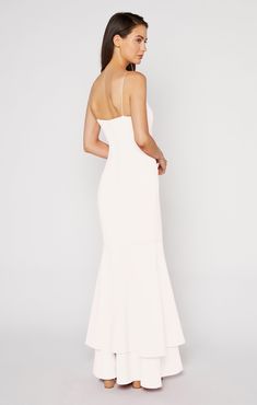 Juxtaposing the simple straight neck and straps, this flowy, double-tiered, mermaid-style gown will make a statement at every formal event.The Aurora Gown in white is a "soft white". Fit Details FittedLinedFit-and-flare silhouetteZipper and button closure on backDouble layer ruffle hem73% Polyester 22% Rayon 5% Spandex Dry Clean Only ImportedMeasurementsLength: 62.75in/159.39cm, from top edgeMeasurements from size 4 White Graduation Dress Long, Spring Formal Dresses Long, White Formal Dress Long, Long White Flowy Dress, Aurora Gown, White Formal Gowns, Spring Formal Dresses, Graduation Dresses Long, Sweet Sixteen Dresses