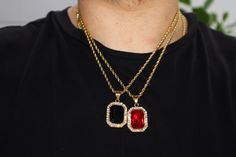 FAST SHIPPING!*TRUSTED SELLER**2300+ TRANSACTIONS* -Will be shipped through USPS with First Class Mail that includes tracking so you'll get it quick! WONT TURN YOUR NECK GREEN! WONT TARNISH. WONT FADE! -Premium 14k gold plated over stainless steel CZ diamond Ruby pendant. -Comes with 20 inch 3mm stainless steel gold plated rope chain. -Stones are high quality VVS simulated lab diamonds(CZ)! -Pendant is about 1 inch tall(without bale) and 3/4 inch wide. -NEW! -Very good quality. Looks even better Gold Rope Chain Jewelry For Streetwear, Gold Rope Chain Jewelry, Black Pendant Jewelry For Streetwear, Black Pendant Jewelry With Rope Chain, Red Black Green, Unique Pendant Necklace, Ruby Pendant, Cz Diamond, Stone Pendant