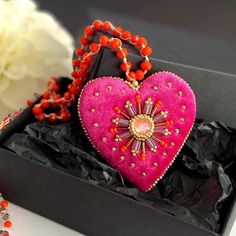 This bright pink heart pendant necklace will  definitely add a charm to any outfit or can be a perfect gift for any occasion.  Long orange glass beads necklace is crocheted by hand  with orange glass beads and embellished with hot pink velvet heart pendant. The pendant is embroidered with glass beads and the sparkle crystal in the center. This unique handmade piece of jewelry could be a perfect gift for whose who loves handcrafted artsy jewelry.  💝Jewelry comes in a lovely box and is ready for Heart Beads Pendant Necklace For Gifts, Valentine's Day Beaded Party Necklace, Valentine's Day Gift Pink Beaded Necklaces, Heart-shaped Colorful Beaded Necklaces As Gift, Colorful Beads Heart Shaped Beaded Necklace Gift, Heart Shaped Colorful Beaded Necklaces For Gifts, Valentine's Day Necklaces With Colorful Beads, Party Beaded Necklace With Heart Pendant, Heart Charm Beaded Necklace For Gift