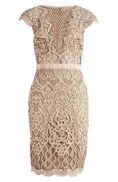 An elegant frock exquisitely fashioned from ornate lace sparkling in tonal sequins is perfect for weddings, cocktail parties and date nights. 39 1/2" length (size 8) Hidden back-zip closure Bateau neck Cap sleeves Partially lined 60% polyester, 40% nylon Dry clean Imported Evening Mother Of The Bride Dress With Scalloped Lace, Lace Mother Of The Bride Dress For Gala, Luxury Lace Embellished Evening Dress, Fitted Evening Dress With Delicate Lace, Luxury Sleeveless Lace Evening Dress, Elegant Cocktail Dress With Delicate Lace, Elegant Beige Lace Dress With Delicate Lace, Elegant Beige Lace Dress With Delicate Details, Elegant Delicate Lace Cocktail Dress