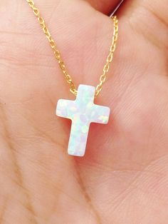 Synthetic White Opal Cross pendant, comes with a 925 Sterling Silver necklace, Yellow gold plated, Rose gold plated. Notice that this necklace comes with extender to adjust to different lengths. Chain total length : 39.5 cm / 15.5 inches not included extender. Extender length : 2.5 cm / 1 inche approximately Cross size: 12mm x 9mm Spring clasp Our jewelry is packaged in a beautiful gift box. If you need a necklace as a gift, we can ship to third party. During check out, please leave a note in th White Cross Pendant Clavicle Necklace, Dainty White Cross Necklace, White Cross Necklace As A Gift, Gold Plated Cross Necklace For Gift, White Clavicle Chain Cross Jewelry, Rose Gold Plated Cross Necklace, 14k Gold Cross Jewelry In White, White 14k Gold Cross Jewelry, Tarnish Resistant White Necklace For Gift