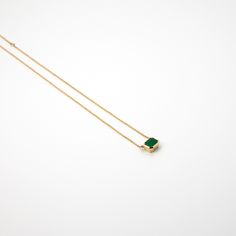 This necklace was the result of the "Emerald project", created between a group of friends with the need to share feelings, it represents that spark of light in your heart when you think about friendship. - Handmade necklace- Adjustable recycled 14k yellow gold chain measures 210mm or 160mm long- Emerald is set in handcrafted, recycled 14k yellow gold Healing Birthstone Pendant Gemstone, Luxury Gemstone Necklaces As A Gift For Her, Luxury Amethyst Birthstone Necklace, Spiritual Birthstone Gemstones As Gifts, Luxury Necklace With Rectangular Gemstone, Luxury Gemstone Necklace As Gift, Minimalist Jewelry With Rectangular Birthstone, Emerald Necklace With Round Pendant As A Gift, Luxury Gemstone Necklace For A Gift