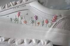 A gorgeous rainbow wildflower design stitched onto your shoe type choice. Choose from Vans, converse, Superga or any other canvas based shoe. SHOE OPTIONS Choose size from drop down menu.  DESIGN INFO: Lavender, daisies and bees with a touch of pink. Delicate and unique. It has embroidery on the two outer sides of the shoes, the two inner sides are left blank. SHOE OPTIONS I can sew onto any non branded or branded canvas shoes If I am buying the shoes, provide the shoe size and confirm whether it is EU, UK or US (men's/women's) sizes. If you are sending shoes to me then I will provide my postal address once you have placed your order. I am in the UK so for worldwide orders it may work out more cost effective for me to purchase the shoes on your behalf. MAKING TIME: Making time can be up to Daisies And Bees, Embroidery Hats, Custom Wedding Shoes, Wildflower Design, Wedding Sneakers, Vans Converse, Hat Embroidery, Shoes Custom, Wildflower Wedding