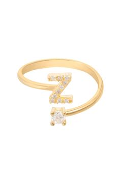 Design: This simple but beautifully styled initial letter ring is perfect for those who covet delicate jewellery with a hint of sparkle offering a sophisticated finishing touch to any outfit. Pretty and petite, this initial ring features an open band, which allows for slight adjustability with sizing. The opening is designed to be on top of your finger, where your zircon adorned monogram is on one side and a single larger cubic zirconia resides on the other. What can be more personal than a name Initial Ring Gold, Metallic Rings, Gold Initial Ring, Delicate Jewellery, Gemstone Earrings Gold, Zierlicher Ring, Letter Ring, Writing Gifts, Initial Ring