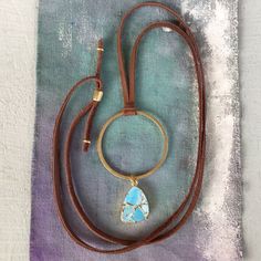 New Handcrafted Necklace Adjustable To 30” Brown Genuine Leather Soft Deerskin Cord Blue Turquoise Gold Plated Pendant Approx 20-15mm Antique Gold Tone Brass Circle 1.5” Diameter Handcrafted In California, Not Associated With Sundance Catalog Brand Bundle Up And Save Even More 10% Please Review My Other Handcrafted Unique Jewelry On Sale Fast Shipping Adjustable Brown Turquoise Bohemian Necklace, Handmade Adjustable Brown Turquoise Necklace, Blue Adjustable Necklace For Everyday Use, Blue Handmade Necklace For Everyday Use, Blue Bohemian Necklaces For Everyday Use, Handmade Blue Necklace For Everyday Use, Handmade Blue Necklace For Everyday, Bohemian Blue Necklaces For Everyday Use, Bohemian Brown Necklace For Everyday Use