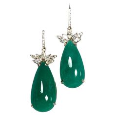 Emeralds Maravellous 56.27 Carats Diamond, Pear-Shaped Cabochon Natural Colombian Emerald Drop Earrings A pair of 18k yellow gold ear dangle, each fitted with bishop diamond 0.12cts hook at the top, set with marquise diamonds and pear-shaped cabochon emeralds. Total diamond weight 1.97 cts. Diamond color H/SI1 clarity, and the Colombian emeralds 54.18 cts. Excellent medium vivid green color. The emeralds are certified by CDTEC stating that they are of Colombian origin with moderate clarity enhan Emerald Drop Earrings, Emerald Diamond Earrings, Emerald Earrings Drop, Diamond Dangle Earrings, Colombian Emeralds, Marquise Diamond, Diamond Color, Emerald Diamond, Pear Shaped