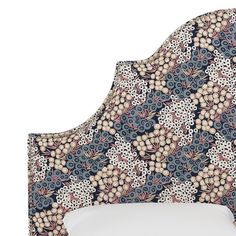 an upholstered headboard with flowers on it