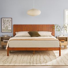 a large bed sitting in a bedroom on top of a wooden floor