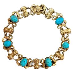 Egyptian revival jewelry became wildly popular during the Art Deco period after King Tut’s tomb was opened in 1922. This wonderfully wearable bracelet features six bezel-set turquoise scarabs mounted between sculpted asps and papyrus frond stations,  finished with a tiny pharaoh closure. 7.25" in length, fabricated in 14k yellow gold. Measurements: 7 1/4" long by 5/8" wide Weight: 18.8 grams Markings: none Egyptian Inspired Jewelry, Art Deco Egyptian, Egyptian Revival Jewelry, Diamond Outline, Art Deco Pendant Necklace, Scarab Bracelet, Art Deco Bracelet, King Tut, Art Deco Pendant