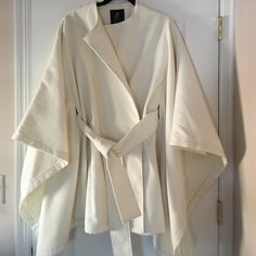 Brand New Without Tags Ivory Rachel Zoe Fall/Winter Cape. Size Small But Runs Big. Side Pockets And Belt. Very Sophisticated Accessory To A Wardrobe. Comes From Pet Free And Smoke Free Home. :) Chic White Cape Outerwear, Chic White Winter Cape, White Long Sleeve Cape For Fall, Chic Beige Cape For Spring, Spring Cream Cape, White Long Sleeve Spring Cape, White Long Sleeve Cape For Spring, Chic White Cape For Fall, Cream Cape Outerwear For Fall