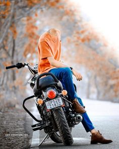 a person sitting on top of a motorcycle