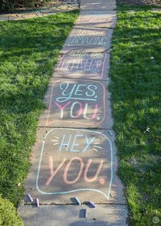 sidewalk with chalk writing on it that says yes you, hey you and thank you