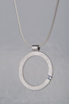 Are you looking for a gift idea for women? What would you say about this minimalist and delicate moonstone pendant necklace? Combination of this charming and delicate stone and rough, scratched silver surface makes the necklace look modern, but really subtle. Since moonstone is a June birthstone this necklace will be a great birthday gift for her. But it would also be a good choice if you are searching for an anniversary gift for your wife or girlfriend, or simply for yourself :) CHARACTERISTICS White Gold Moonstone Round Pendant Jewelry, Modern Silver Full Circle Jewelry, Minimalist Sterling Silver Oval Pendant Jewelry, Minimalist Silver Full Circle Jewelry, Modern Sterling Silver Jewelry With Pearl Pendant, Minimalist Round Bezel Setting Necklace, Minimalist Full Circle Silver Jewelry, Silver Round Pendant Birthstone Necklace, Silver Birthstone Necklace With Round Pendant