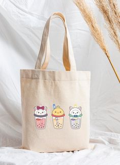 These cute boba canvas tote bags are reusable and can carry up to 30 pounds.  ITEM SIZE: 16in x 16in x 5in; 12 oz Price is for 1 sheet/decal/pack/charm/bag and pens are not included. ✿ DISCLAIMER Actual colors may be different on screen than the actual product. ✿ SHIPPING & TRACKING NUMBER If you would like a tracking number with your order, please message me! *Please understand that I will not be able to cover the cost for any lost mail for standard shipping! ✿ REFUNDS & CANCELLATIONS I will on Cute Beige Canvas Bag For Daily Use, Harajuku Style Tote Canvas Bag For Daily Use, Rectangular Bags With Cartoon Print For Daily Use, Cute Beige Canvas Bag For Everyday Use, Cute Beige Canvas Bag, Cute Bags With Cartoon Print For Everyday Use, Cute Everyday Bags With Cartoon Print, Cute Cartoon Print Bags For Everyday Use, Cute Rectangular Beige Canvas Bag