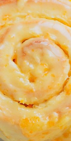 a close up view of the inside of a pastry with cheese and sauce on it