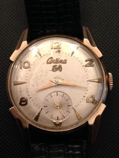 "Certina watches established in 1888 and were made in Switzerland, currently the brand owned by Swatch Group. In 1940 the Certina watches advertised as Certina Watch Corp. of America. and were the predecessors brand of Grana and have been exported to USA as early 1910. This watch made by Certina, Switzerland is 17 Jewels manual movement and was cased in USA by Illinois Watch Case Co. (IWCCo) in 1951. Certina also supplied movements to Hamilton Watch Co. This watch produced in 1951 in a small num Vintage Watches With Tachymeter As Gift, Vintage Tachymeter Watch As Gift, Vintage Tachymeter Watch For Gift, Classic Chronograph Watch As Collectible, Classic Collectible Chronograph Watch, Vintage Analog Round Watches, Vintage Formal Watch With Tachymeter, Vintage Round Watch With Tachymeter, Vintage Round Watches With Tachymeter