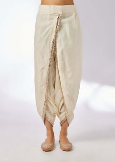 This pretty ensemble in floral jaal, combines gota and dori buttis with an intricate border embroidery. The short kurta with a dhoti embroidered in sequins and gold thread, adds a feminine grace. Indian Arts And Crafts, Short Kurta, Nyc Studio, Border Embroidery, Nehru Jackets, Indian Textiles, Western Wedding, Gold Thread, Short Suit