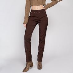 Vintage late 90s mid-rise trousers in brown with a tapered leg, and a buttoned front reminiscent of the style of a classic crackerjack Navy uniform. The fabric has a twill texture and a shiny appearance. Shown clipped on the model until the last two photos. Measurements and Condition:    Fits like: Labeled size 28, fits modern women's small. Fabric: Labeled 100% cotton, but it has shine - feels similar to nylon or polyester, almost like windbreaker fabric Brand: Z. Cavaricci, made in USA  Condit High Waist Brown Bottoms With Buttons, Brown High Waist Bottoms With Buttons, Brown Bottoms With Button Closure For Spring, Brown Bottoms With Button Closure For Work, Spring Brown Bottoms With Button Closure, Brown Pants With Button Closure For Fall, Fitted Bottoms With Snap Buttons For Fall, Retro Bottoms With Button Closure For Fall, Vintage Bottoms With Button Closure For Fall