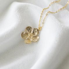 "Beautiful and lovely gold flower necklace.  Made of semi-matte finish gold flower with skinny gold brass chain.  A simple and natural-looking dainty necklace is good for yourself or gift! Your necklace will ship in a lovelike gift box. If you have any questions please feel free to contact me. Thanks :)  ♥ Chain length available 14\" - 20\"  ♥ Flower pendant 3/4\"   ♥ Gold Plated over Brass   ♥ ♥ ♥ ♥ ♥ ♥ ♥ ♥ ♥ ♥ ♥ ♥ ♥ ♥ See more by lovelikestyle lovelikestyle.etsy.com ♥ ♥ ♥ ♥ ♥ ♥ ♥ ♥ ♥ ♥ ♥ ♥ ♥ ♥ Gold Plated Flower Necklace With Clavicle Chain, Gold-plated Clavicle Flower Necklace, Gold-plated Flower Necklace With Clavicle Chain, Delicate Gold Charm Necklace With Flower, Delicate Gold Charm Necklace With Flower Design, Delicate Gold Charm Necklaces In Brass, Gold Pendant Flower Necklace With Clavicle Chain, Dainty Gold Plated Flower Necklace, 14k Gold Filled Flower Necklace