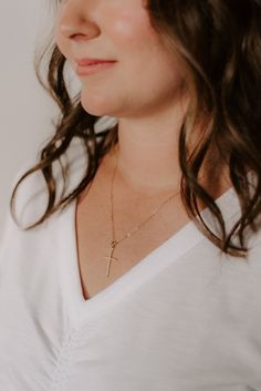 Our popular vertical cross pendant is a subtle statement to add sparkle to any look. split 18k gold-filled vertical cross pendant + CZ accent stones Your choice of chain length (16", 18", or 20") All materials are lead & nickel free Handmade with love by Luna & Jade in the U.S. Everyday Cross Charm Necklace With Clavicle Chain, Everyday Cross Pendant Charm Necklace, 14k Gold Filled Cross Pendant Jewelry With Adjustable Chain, Hypoallergenic Cross Jewelry For Everyday, Everyday Cross Jewelry With Adjustable Chain, Everyday Yellow Gold Cross Charm Necklace, Adjustable Cross Jewelry For Everyday, Everyday Hypoallergenic Cross Jewelry, Everyday Cross Necklace With Clavicle Chain