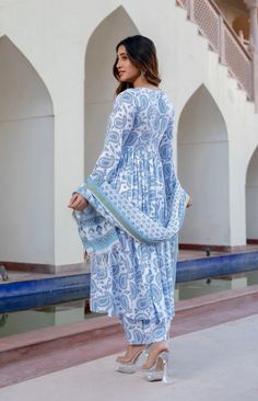 Grab this beautiful 3-piece set. The set comes with block print kurta has v neck, full sleeves & calf length teamed with printed trouser pants and a printed kota doria dupatta to match. Color - Blue Kurta Fabric-Viscose Pant Fabric-Viscose Dupatta Fabric- Kota Doria Neck-V Neck Sleeves-Full Sleeves Work - Print & Embroidery Detailing Washing Instructions-Dry Clean Model Height - 5.5 wearing size small. DISCLAIMER - The color of the product may be differ due to screen settings of device. A misprint here and a colour drop slip there is the beauty of printing which is not treated as a defect. Block Printed Suits, Blue Kurta, Kurta Pant Set, White Kurta, Kurta With Pants, Womens Size Chart, Full Sleeves, Pant Set, Fabric Shop