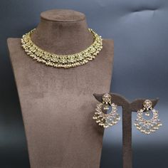 Set includes- 1 Necklace + 1 Pair of Earrings + 1 Headpiece ( Tikka ) Polish - Gold Metal - Brass Note-  Due to the lighting, there may be a slight variation in the color of the jewelry in the photo. Please do not hesitate to contact us with any questions or requests for personalization of the set. Elegant Jewelry Sets For Parties, Gold Dangle Bridal Necklace For Party, Kundan Jewelry For Celebration, Bohemian Jewelry With Jewels For Wedding, Bohemian Round Jewelry For Wedding, Bohemian Jeweled Jewelry For Weddings, Bohemian Jeweled Wedding Jewelry, Bohemian Wedding Jewelry With Jewels, Green Bridal Earrings For Party And Festivals