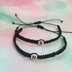 A Perfect matching bracelet! ideal gift to express your love and friendship to that special person in your life. (Black initials bracelet), You can choose different colors in the menus box. Include a (Wish card) Pinky promise bracelet. Bracelet Features: (1) 0.8mm Nylon Cord (2) Acrylic Letter Beads (3) Bracelet is adjustable MIN SIZE 5 INCHES TO 13 INCHES. if you want other size let me know. (4) Cord color options are available. Adjustable Black Bracelet For Birthday Gift, Adjustable Black Bracelet For Birthday, Adjustable Black Wristband For Birthday Gift, Adjustable Black Wristband As Birthday Gift, Adjustable Black Wristband, Trendy Handmade Black Name Bracelet, Trendy Letter Bracelets For Friendship, Trendy Adjustable Bracelets With Initials, Trendy Friendship Bracelets With Letter Print