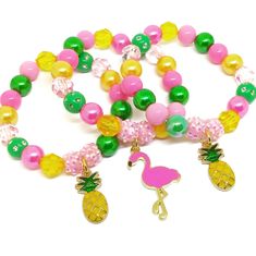 a necklace with pink, yellow and green beads