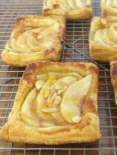 four pieces of apple pie on a cooling rack