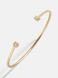 Our 18K Gold Double Initial Custom Cuff Bracelet is an updated take on a classic initial accessory. Available in an all-gold and a subtle sparkly version, these bracelets are ones you'll have for years to come. Add your own initials or that of you and a loved one to create a keepsake you'll cherish. Not to mention, this cuff bracelet is crafted with 18K gold plated sterling silver and Cubic Zirconia stones. Luxury Bracelets With Initials For Anniversary, Luxury Gold Bracelets With Initials, Luxury Yellow Gold Name Bracelet With Initials, Elegant Gold Bracelet With Initials, Formal Gold Bracelets With Initials, Elegant Yellow Gold Monogram Bracelets, Elegant Yellow Gold Monogram Bracelet, Custom Cuff Bracelet, Customised Bracelets