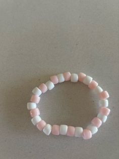 pink and white beaded bracelet Cute Pink Beaded Stretch Bracelet, Cute White Handmade Pearl Bracelet, Cute Handmade White Pearl Bracelet, White Stretch Bracelet With Colorful Beads, White Hand-strung Pearl Bracelet With Round Beads, Hand-strung White Pearl Bracelet With Round Beads, Hand-strung White Pearl Bracelet, Cute White Beaded Pearl Bracelet, Pink Pearl Bracelet With Letter Beads