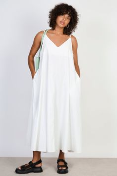 White V neck floaty midi dress Flowy V-neck Breezy Maxi Dress, Flowy V-neck Summer Dress, Unlined A-line Midi Dress For Summer, Chic V-neck Sundress For Spring, Casual A-line Maxi Dress Unlined, Flowy A-line Midi Dress In Viscose, Chic A-line Beach Slip Dress, V-neck Maxi Sundress For Day Out, Chic A-line Maxi Dress For Daywear