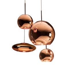 three copper colored lights hanging from the ceiling