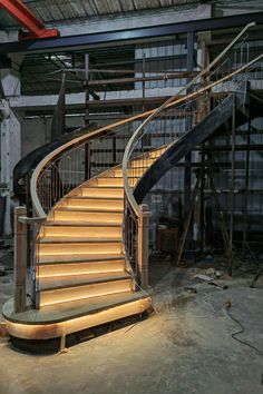 a set of stairs leading up to the top of a stairwell in an industrial building