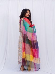 Welcome this season with round neck kurti with an intricate colorful heavy print and a pintuck detailing on the yoke. Paired with this ghera kurta is a similar print palazzo and a pure chanderi printed duppata. Features: 100% Premium Cotton Printed Suit Set Chanderi Dupatta Comfort fit Model height is 5.5 feet and is wearing size M Wash Care Instructions: Dry Clean Only Note: The product will be delivered within 15-20 days of the order placed. The product can be made on order, in which case the Bohemian Chanderi Palazzo Set With Long Sleeves, Bohemian Long Sleeve Chanderi Palazzo Set, Festivals Cotton Silk Kurta With Sheer Dupatta, Semi-stitched Bohemian Kurta With Sheer Dupatta, Multicolor Anarkali Set With Printed Motifs For Navratri, Multicolor Long Sleeve Anarkali Set, Bohemian Cotton Silk Set With Sheer Dupatta, Bohemian Set With Sheer Dupatta In Cotton Silk, Bollywood Style Multicolor Printed Anarkali Set