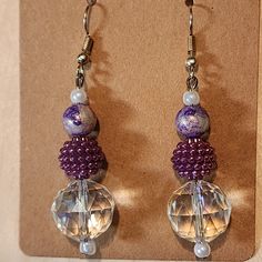 Add some sparkle to your outfit with these elegant Purple Drop Earrings. These earrings feature stunning faceted beads in shades of purple, complemented by shimmering crystal accents. Perfect for a night out or adding a touch of glamour to your everyday look, these earrings are sure to catch the eye. The drop style is both elegant and versatile, making them the perfect addition to any jewelry collection. Crafted from high-quality materials, these earrings are designed for durability and long-lasting wear. The beautiful color combination is sure to complement any outfit - from casual jeans and a tee shirt, to an elegant evening gown. Make a statement with these stunning Purple Drop Earrings - perfect for adding some sparkle and shine! Adjustable Crystal Earrings With Faceted Beads, Elegant Faceted Beaded Drop Earrings, Elegant Lavender Beaded Drop Earrings, Elegant Lavender Beaded Earrings, Purple Faceted Beads Jewelry For Party, Purple Jewelry With Faceted Beads For Party, Purple Crystal Earrings For Pierced Ears, Purple Round Beaded Earrings With Ear Wire, Party Drop Earrings With Faceted Beads