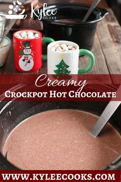 hot chocolate with marshmallows in it and two mugs filled with creamy crockpot hot chocolate