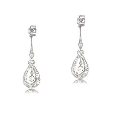 This lovely pair of earrings is Edwardian inspired, featuring intricate details in handcrafted platinum. Old mien cut diamonds are set along the drop of the earrings, surrounding the center diamond. The total approximate weight of these earrings is 2.00 carats. ✦ EARRING SPECIFICATIONS: Ring Material: Platinum Ring Era: Edwardian Era Stones: Diamond ✦ WHAT COMES IN YOUR SHIPMENT: - Your Engagement Ring - Quality Ring Box - Jewelry Cleaner - UGL Certificate ✦ WHY SHOP WITH US: - We've been in bus Formal Pear-shaped Platinum Earrings, Platinum Drop Earrings As Gift, Platinum Drop Earrings For Gift, Exquisite Platinum Diamond Earrings In Silver, White Gold Platinum Drop Bridal Earrings, Platinum White Gold Drop Bridal Earrings, Elegant Platinum Drop Bridal Earrings, Elegant Platinum Bridal Drop Earrings, Formal Platinum Drop Bridal Earrings