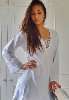 "'White Morrocan Tunic Dress - Karima's style-\" This is a vintage Moroccan Tunic dress ideal for any casual wear. Made in the traditional Moroccan tunic style, this tunic has some fabulous embroidery work. I hope you can enjoy them and be able to touch the moroccan art in your fashion. This tunic could be comfortably worn with any Jacket /Cardigan, and would look FAB with high heels,or leather boots. Could be worn with belts too Sizes: One Size (fits S-L size) Bust: 105 cm, Length: 35\" (87cm) Long Sleeve Beachwear Dresses For Holiday, Holiday Beachwear Dresses With Long Sleeves, Long Sleeve Boho Dress For Beach, Free Size Long Sleeve Beach Dress For Summer, Hippie Long Sleeve Vacation Dresses, Free Size Long Sleeve Beach Dress, Long Sleeve Free Size Beach Dress, White Tunic Beach Dress, Loose Fit Long Sleeve Beach Dress For Beach Season