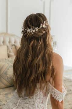 the back of a woman's head wearing a bridal hair comb