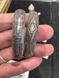 ***- This listing is just for the one cuff that appears alone in the first picture... The others are also available in my shop in the section titled "Fine Jewelry". Please have a look...Navajo, Vincent Joe Platero, Sr., Native American Indian traditional hand stamp work closed bracelet / bangle  / cuff...  stackable... Heavy stamp work forms repeat patterning/design...  oxidized patina finish... signature hallmark stamp: VJP & sterling stamp...  8" interior circumference x .5" wide.  27.5 grams. Antique Stamped Sterling Silver Cuff Bracelet, Antique Silver Stamped Cuff Bangle, Traditional Silver Bracelets With Patina, Unique Stamped Sterling Silver Collectible Bracelet, Antique Silver Stamped Bangle Bracelet, Silversmithing Jewelry, Native American Bracelets, Navajo Bracelet, Silver Turquoise Jewelry