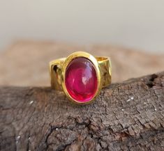 18k Gold Vermeil Ruby Ring, Statement Ring, Cabochon Red Ruby, Red Cherry, Rare Stone, Matte Gold Bezel Setted, Wedding ring, Gift for her PRODUCT DETAIL Product               :  Ring Metal                    : Sterling Silver (18K Yellow Gold Plated) Metal Purity        :  925 Total Weight       :  9.2 GMS (Approx.) Ring Size             :  All Size Metal   925 Solid Sterling Silver (18K Yellow Gold Plated) GEMSTONE DETAILS  Stone Name          :   Ruby  Stone Shape         :   Oval 10x14 mm St Ruby Cabochon Round Jewelry, Yellow Gold Cabochon Ruby Ring, Formal Red Rings With Bezel Setting, Heirloom Red Ruby Cabochon Ring, Heirloom Red Cabochon Ruby Ring, Ruby Cabochon Rings For Anniversary, Cabochon Ruby Ring For Anniversary, Red Bezel Setting Fine Jewelry, Red Fine Jewelry With Bezel Setting